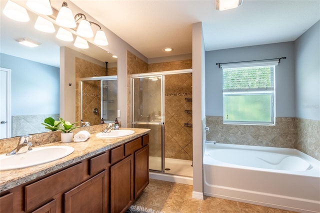 12208 Mcmullen Loop, Riverview, FL 33569 - full bathroom with a garden tub, a shower stall, double vanity, and tile patterned floors