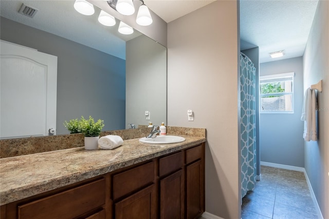 12208 Mcmullen Loop, Riverview, FL 33569 - full bathroom with vanity, baseboards, and tile patterned flooring