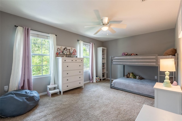 12208 Mcmullen Loop, Riverview, FL 33569 - bedroom with carpet floors, ceiling fan, and baseboards
