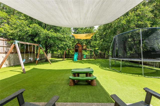 12208 Mcmullen Loop, Riverview, FL 33569 - view of yard with a trampoline and a playground
