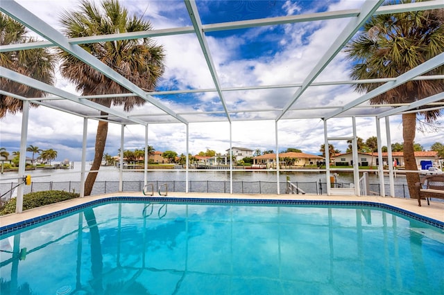 2096 Massachusetts Ave NE, Saint Petersburg, FL 33703 - swimming pool featuring a water view, glass enclosure, a patio area, boat lift, and a boat dock