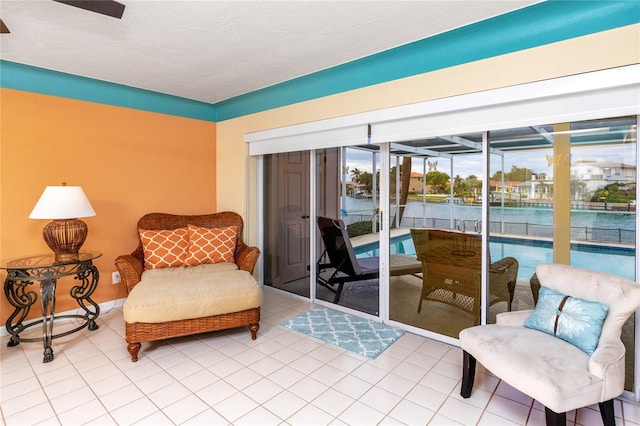 2096 Massachusetts Ave NE, Saint Petersburg, FL 33703 - sitting room featuring tile patterned flooring and a ceiling fan