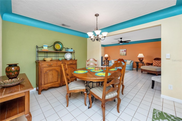 2096 Massachusetts Ave NE, Saint Petersburg, FL 33703 - dining area featuring light tile patterned floors, a chandelier, and ceiling fan