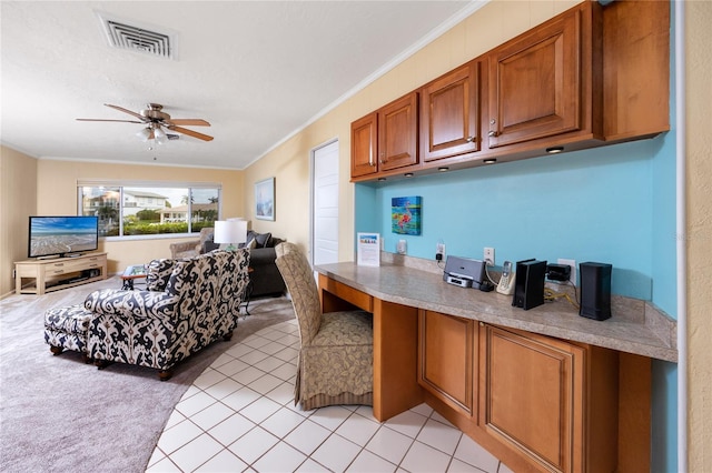 2096 Massachusetts Ave NE, Saint Petersburg, FL 33703 - kitchen featuring open floor plan, brown cabinetry, a ceiling fan, crown molding, and light countertops