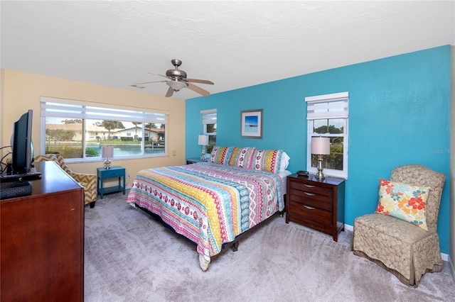 2096 Massachusetts Ave NE, Saint Petersburg, FL 33703 - carpeted bedroom with multiple windows, baseboards, and a ceiling fan