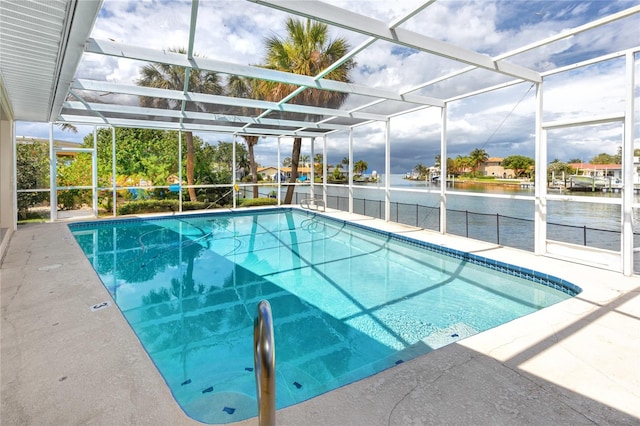 2096 Massachusetts Ave NE, Saint Petersburg, FL 33703 - outdoor pool featuring a water view, a patio, and glass enclosure