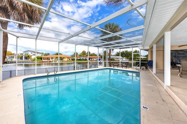 2096 Massachusetts Ave NE, Saint Petersburg, FL 33703 - swimming pool with a patio area, a water view, and a lanai