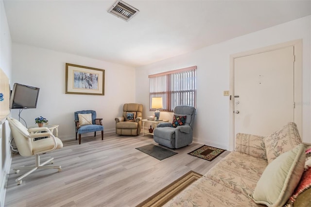 4748 Azalea Dr Unit 204, New Port Richey, FL 34652 - sitting room with wood finished floors and baseboards