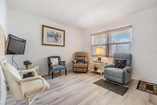 4748 Azalea Dr Unit 204, New Port Richey, FL 34652 - living area featuring light wood-type flooring and baseboards