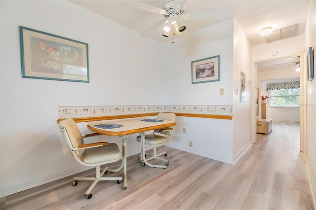 4748 Azalea Dr Unit 204, New Port Richey, FL 34652 - dining room with light wood-style flooring, ceiling fan, and baseboards