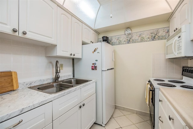4748 Azalea Dr Unit 204, New Port Richey, FL 34652 - kitchen featuring white appliances, a sink, tasteful backsplash, white cabinetry, and light countertops