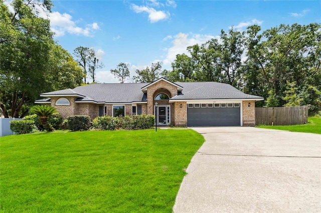 722 Swaying Palm Dr, Apopka, FL 32712 - single story home featuring a garage, concrete driveway, brick siding, and roof with shingles