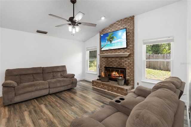 722 Swaying Palm Dr, Apopka, FL 32712 - living area with wood finished floors, vaulted ceiling, a brick fireplace, and ceiling fan