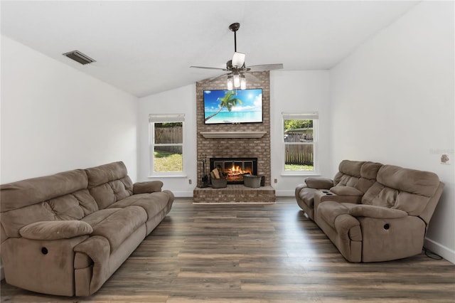 722 Swaying Palm Dr, Apopka, FL 32712 - living room featuring vaulted ceiling, wood finished floors, a ceiling fan, and a fireplace