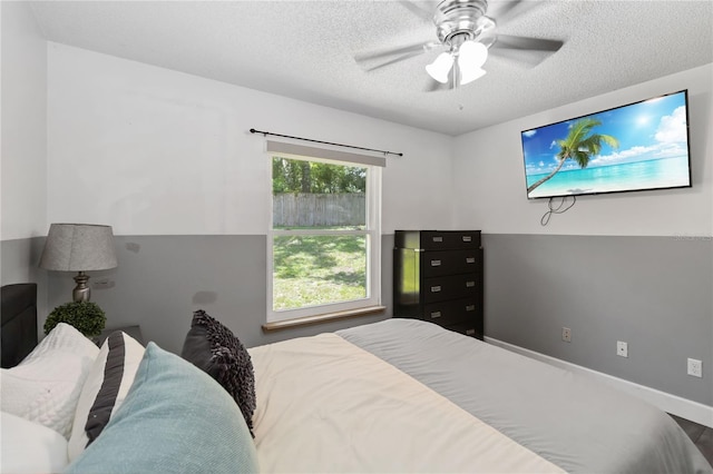 722 Swaying Palm Dr, Apopka, FL 32712 - bedroom featuring a textured ceiling and a ceiling fan