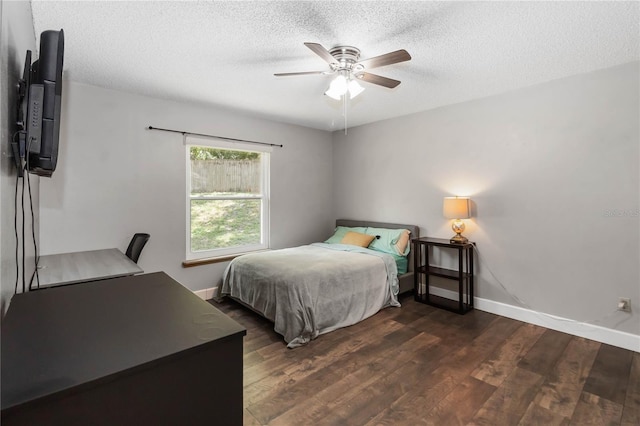 722 Swaying Palm Dr, Apopka, FL 32712 - bedroom with a textured ceiling, wood finished floors, and a ceiling fan