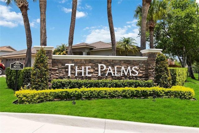 722 Swaying Palm Dr, Apopka, FL 32712 - community sign with a yard and an attached garage