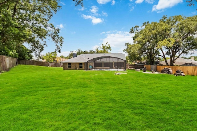 722 Swaying Palm Dr, Apopka, FL 32712 - fenced backyard with glass enclosure