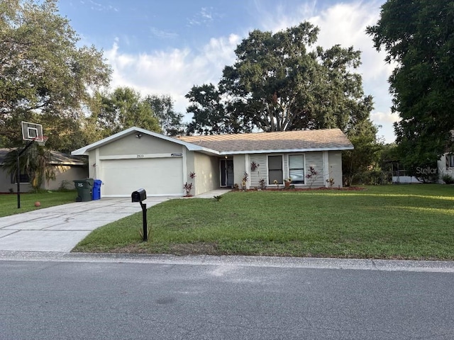 2123 Woodburn Loop S, Lakeland, FL 33813 - ranch-style home with a front yard, an attached garage, driveway, and stucco siding