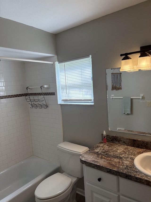 2123 Woodburn Loop S, Lakeland, FL 33813 - full bathroom with toilet, vanity, and shower / washtub combination
