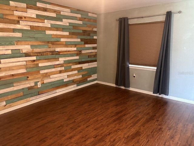 2123 Woodburn Loop S, Lakeland, FL 33813 - unfurnished room with dark wood-style flooring and baseboards