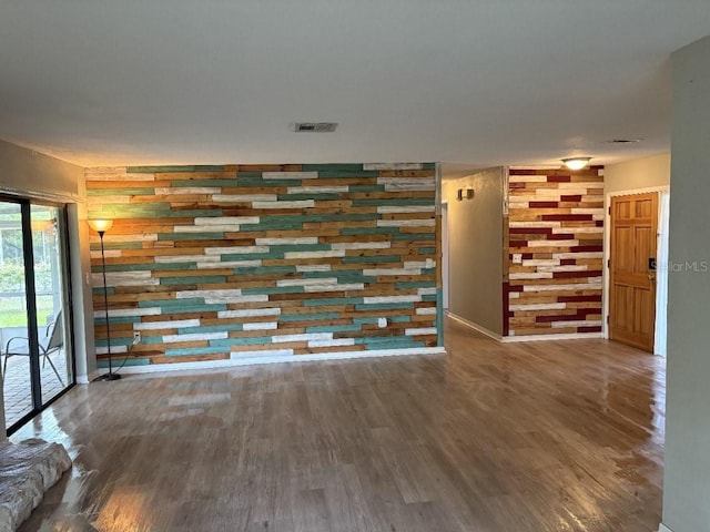 2123 Woodburn Loop S, Lakeland, FL 33813 - unfurnished living room with wood finished floors and baseboards