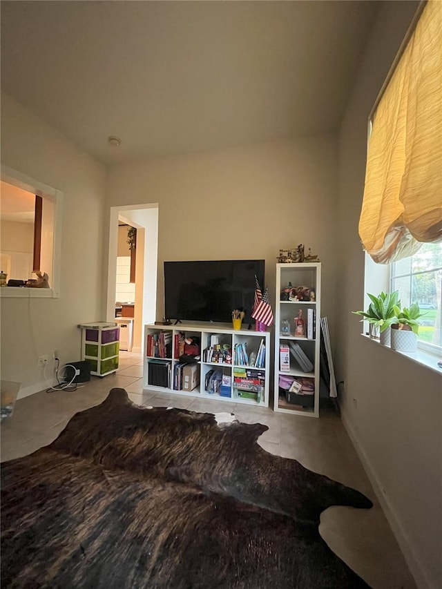 12064 Navale Ln, Orlando, FL 32827 - living area featuring baseboards and tile patterned floors