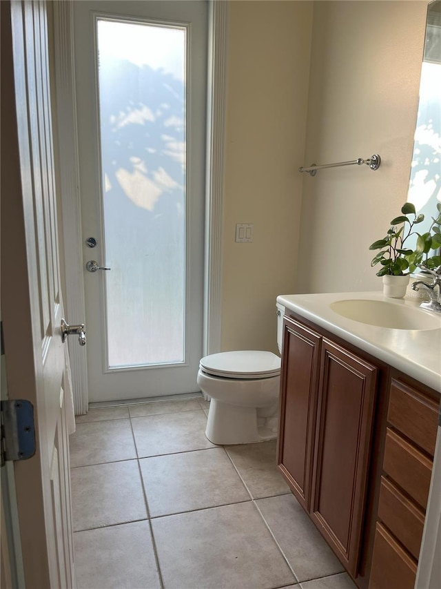 12064 Navale Ln, Orlando, FL 32827 - bathroom featuring vanity, toilet, and tile patterned floors