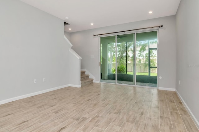 4262 Cloud Hopper Way, Lutz, FL 33559 - empty room with stairway, light wood-style floors, and recessed lighting