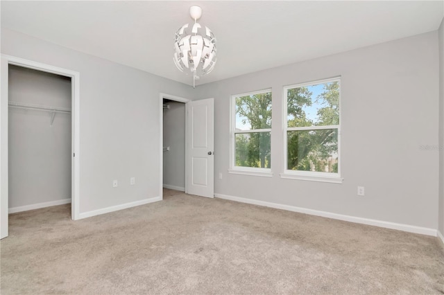 4262 Cloud Hopper Way, Lutz, FL 33559 - unfurnished bedroom featuring a chandelier, carpet, and a closet