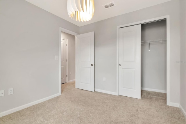 4262 Cloud Hopper Way, Lutz, FL 33559 - unfurnished bedroom with carpet flooring, a closet, and a chandelier