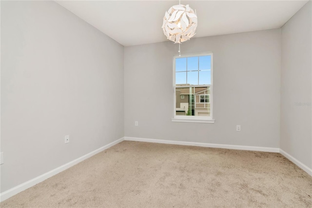 4262 Cloud Hopper Way, Lutz, FL 33559 - unfurnished room with carpet flooring and a chandelier
