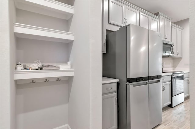 4262 Cloud Hopper Way, Lutz, FL 33559 - kitchen featuring stainless steel appliances, light countertops, and open shelves