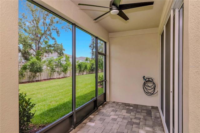 4262 Cloud Hopper Way, Lutz, FL 33559 - unfurnished sunroom with ceiling fan