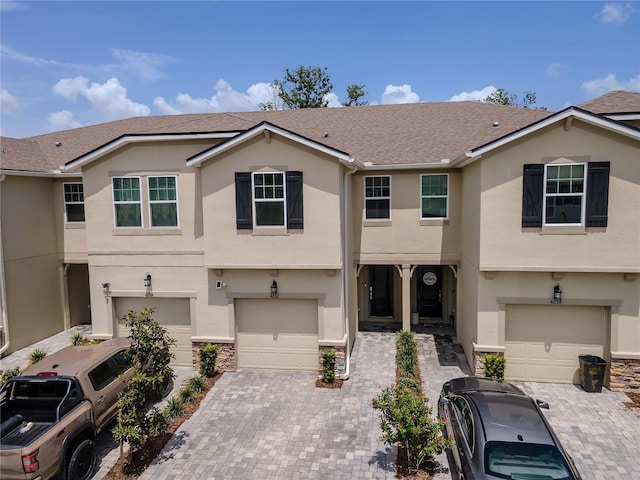 4262 Cloud Hopper Way, Lutz, FL 33559 - multi unit property with an attached garage, stucco siding, driveway, and roof with shingles