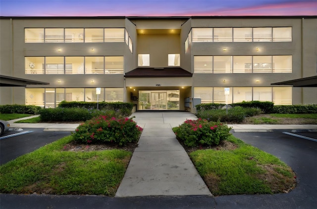 13612 S Village Dr Unit 5201, Tampa, FL 33618 - property at dusk with uncovered parking
