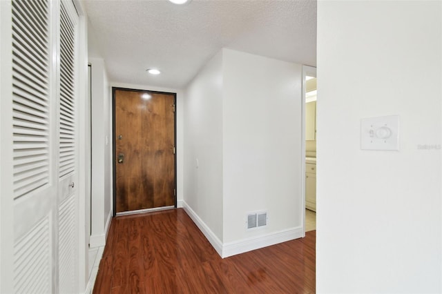 13612 S Village Dr Unit 5201, Tampa, FL 33618 - corridor featuring wood finished floors, baseboards, a textured ceiling, and recessed lighting