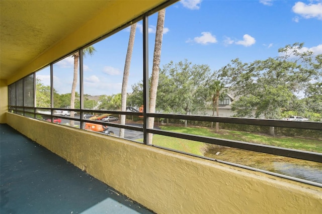 13612 S Village Dr Unit 5201, Tampa, FL 33618 - unfurnished sunroom with concrete floors
