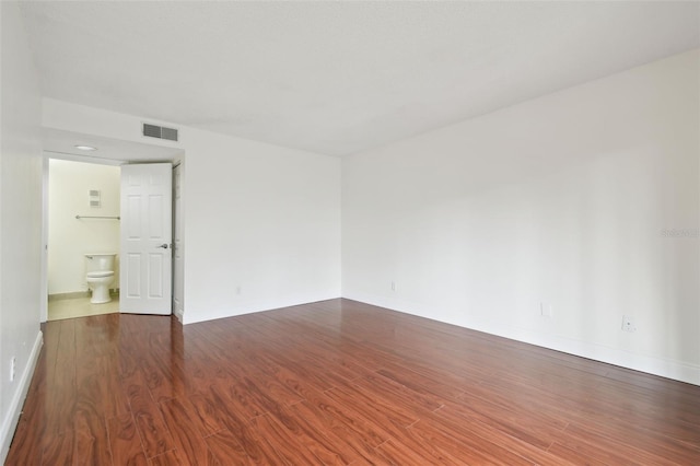 13612 S Village Dr Unit 5201, Tampa, FL 33618 - unfurnished room featuring wood finished floors and baseboards