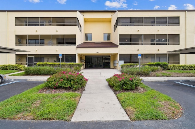 13612 S Village Dr Unit 5201, Tampa, FL 33618 - view of apartment building / complex featuring uncovered parking