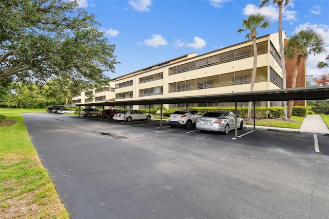 13612 S Village Dr Unit 5201, Tampa, FL 33618 - view of apartment building / complex with covered parking