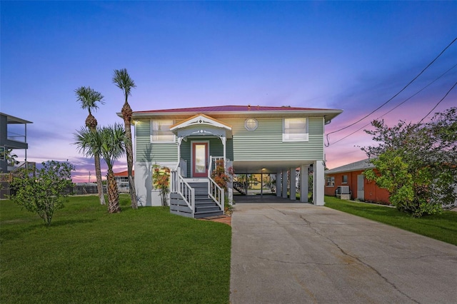 4137 Des Prez Ct, Hernando Beach, FL 34607 - view of front of home featuring a carport, concrete driveway, and a front yard