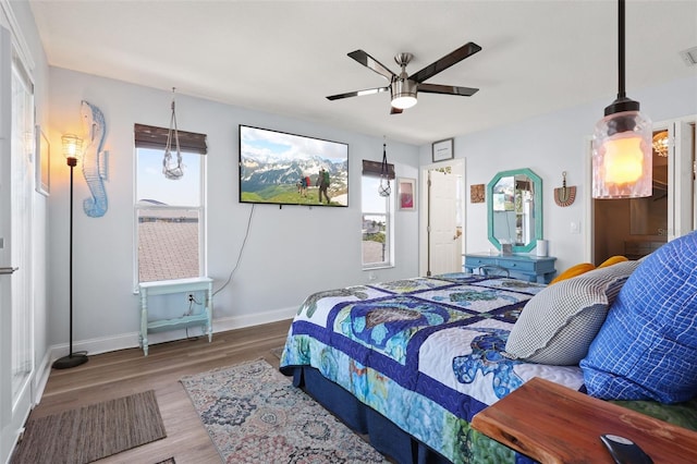 4137 Des Prez Ct, Hernando Beach, FL 34607 - bedroom with wood finished floors, baseboards, and a ceiling fan