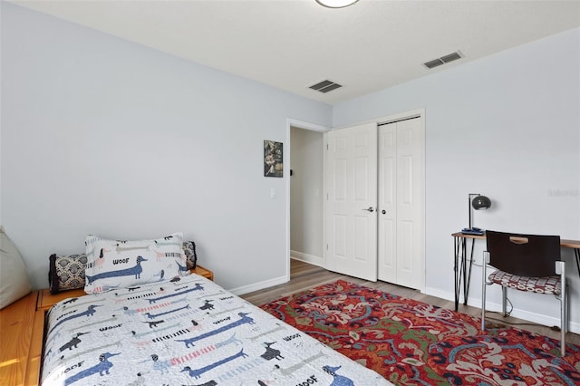 4137 Des Prez Ct, Hernando Beach, FL 34607 - bedroom featuring wood finished floors, baseboards, and a closet