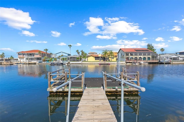 4137 Des Prez Ct, Hernando Beach, FL 34607 - dock area with boat lift, a water view, and a residential view
