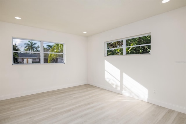 3947 Overlook Dr NE, Saint Petersburg, FL 33703 - unfurnished room featuring plenty of natural light, wood finished floors, recessed lighting, and baseboards