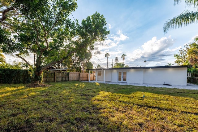 3947 Overlook Dr NE, Saint Petersburg, FL 33703 - view of yard with french doors and a patio
