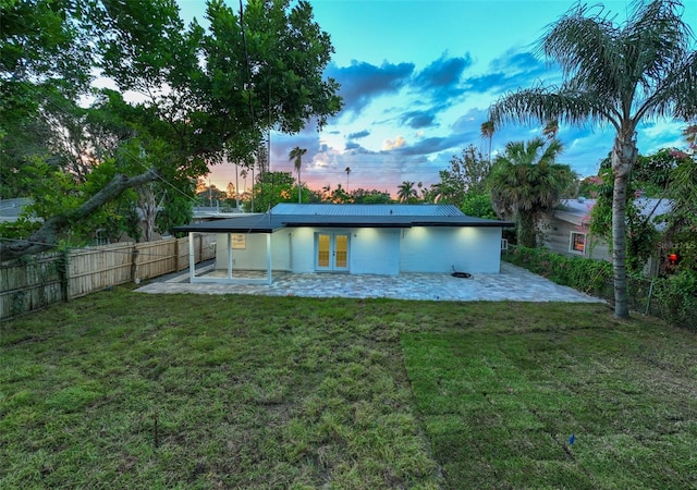 3947 Overlook Dr NE, Saint Petersburg, FL 33703 - back of house with french doors, a patio, and stucco siding