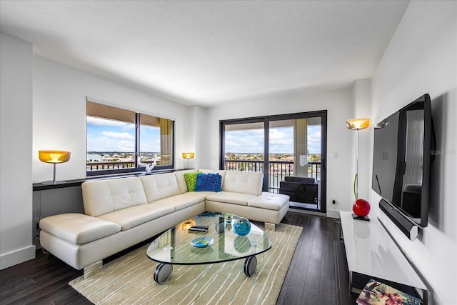 1651 Sand Key Estates Ct Unit 54, Clearwater Beach, FL 33767 - living area with hardwood / wood-style flooring and baseboards