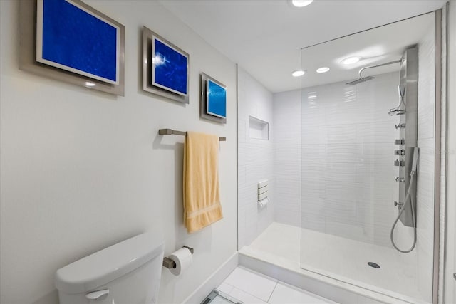 1651 Sand Key Estates Ct Unit 54, Clearwater Beach, FL 33767 - bathroom with toilet, a tile shower, tile patterned floors, recessed lighting, and baseboards
